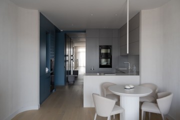 Belgrade Waterfront Apartment living room with neutral tones, dark blue accents and city views