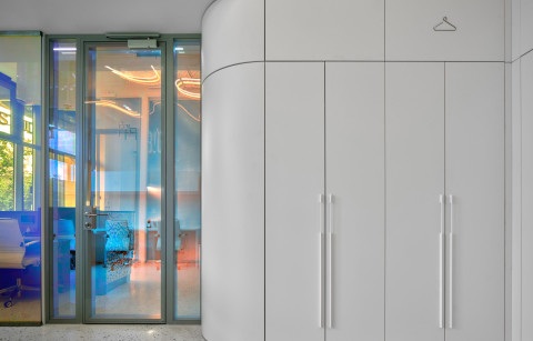 BIG Laboratory room with gradient acrylic surfaces and soft plaster textures