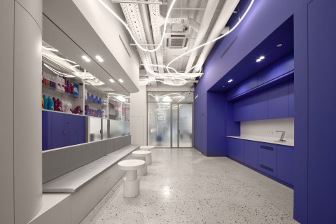 BIG Laboratory interior with glossy metal, mirrored surfaces and bold color accents