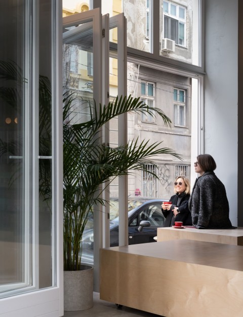Ribbon-shaped communal bench in the Chernyi Cooperative Coffee Roasters interior