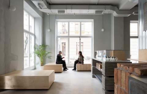 Bright window seating area inside Chernyi Cooperative Coffee Roasters in Belgrade