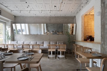 Embers Restaurant interior with layered materials, warm lighting and mixed oriental details