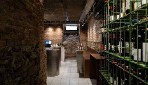 Large view of Fresca Cellar wine bar with raw stone, brickwork and tasting area