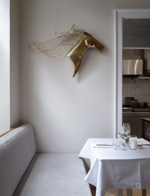 Vertical preview of Fresca Restaurant with warm lighting, table setting and beige interior palette