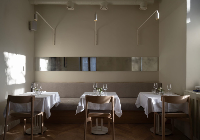 Fresca hospitality interior in Belgrade with historic architectural details and warm dining atmosphere
