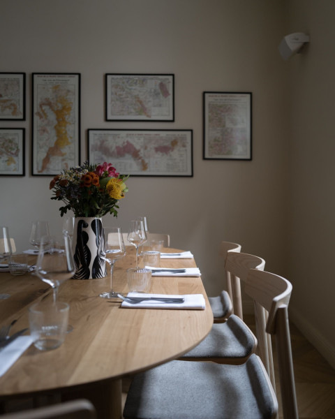 Vertical view of Fresca Restaurant with refined seating and preserved architectural character