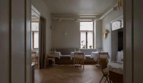 Large view of Fresca Restaurant showing the open kitchen and elegant dining area
