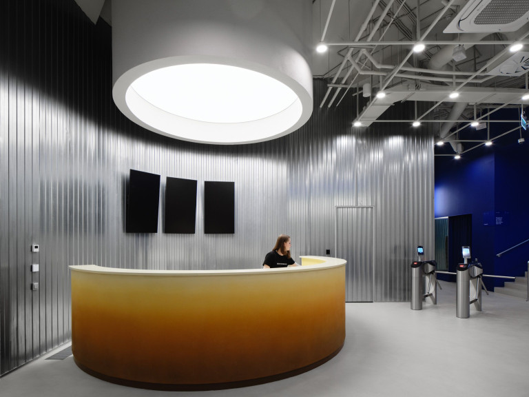 Futuristic reception and gym interior at Gate-X Fitness Club in Moscow