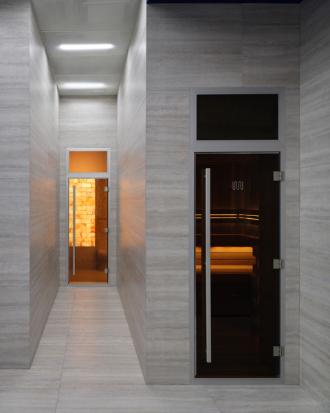 Vertical final interior view of Gate-X Fitness Club with futuristic dark finishes