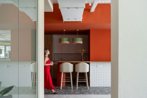 Wide coworking workspace at Haos Community Space with open office layout and warm material palette