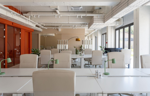 Wide lounge area at Haos Community Space with mural wall and communal seating