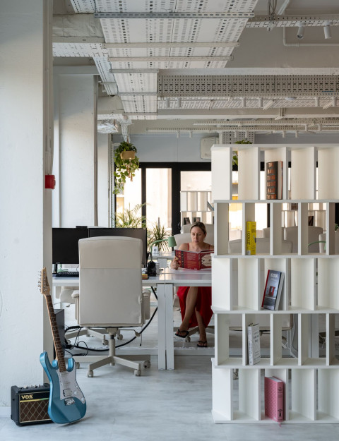 Vertical interior detail at Haos Community Space with Serbian-inspired pattern and warm tones