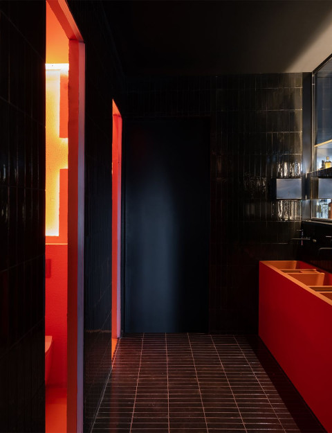 Hookah Restaurant bar counter with dark sculptural form and warm accent lighting