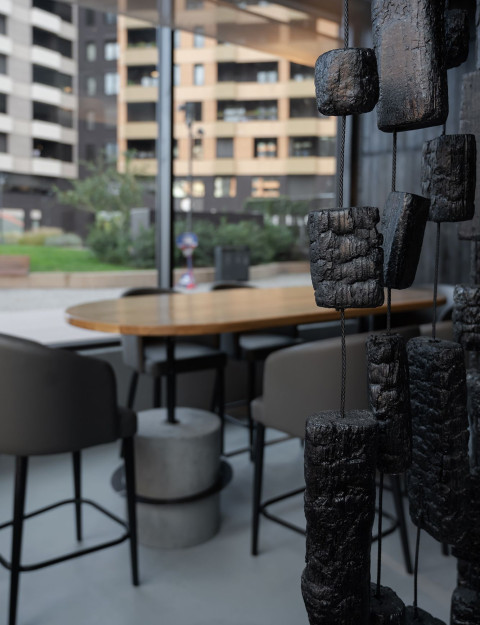Burnt wall panel and dark material detail inside Hookah Restaurant