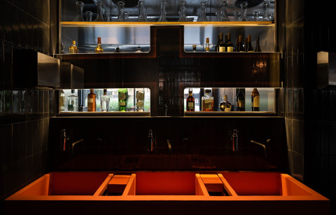 Main table area with smoke-like lamps and dark wood in Hookah Restaurant