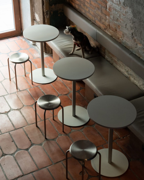 Bathroom grille and industrial detail inspired by subway infrastructure in KuKu Bar