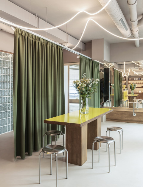 Vertical interior detail with tactile materials at Loka Yoga & Cafe