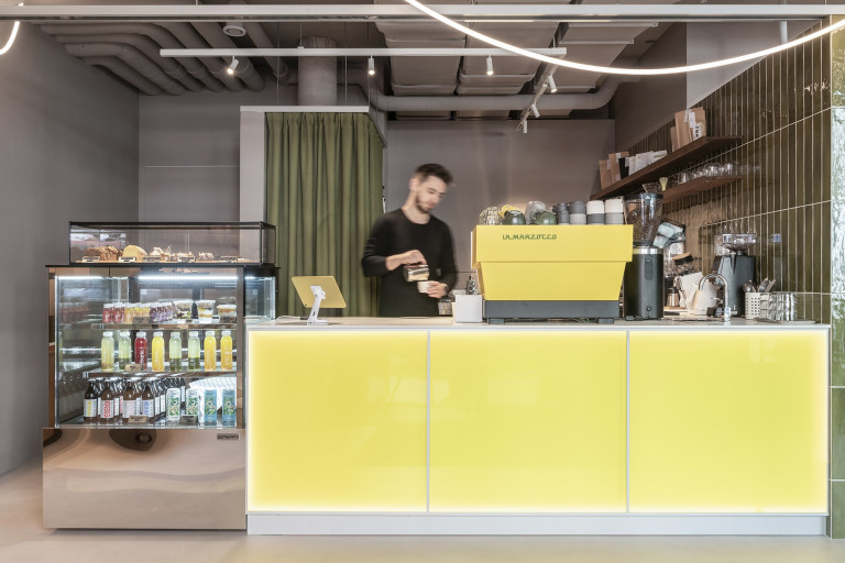 Loka Yoga & Cafe street-level interior in Vienna with yoga and cafe zones