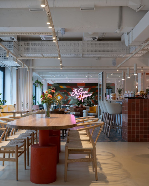 Vertical view of the Peers dining area with warm Mediterranean interior materials