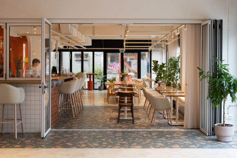 Peers restaurant interior with terracotta kitchen block and warm lighting
