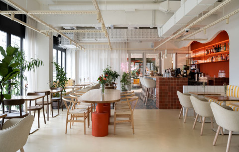 Wide view of the Peers bar and glass partition to the coworking kitchen
