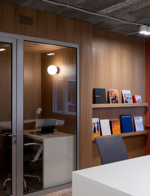 Lounge chair and warm interior detail in PFU Coworking
