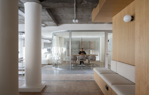 PFU Coworking open space with shared desks, oak cube and exposed ceiling