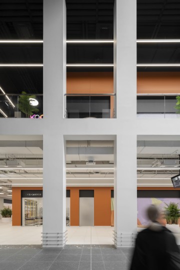 Siesta Shopping Center retail interior with terracotta tones and vertical gallery view