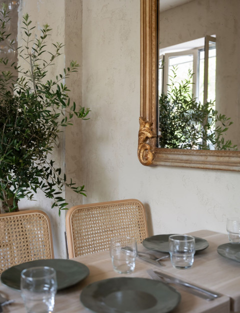 Bench seating and globe pendant light inside Stories restaurant