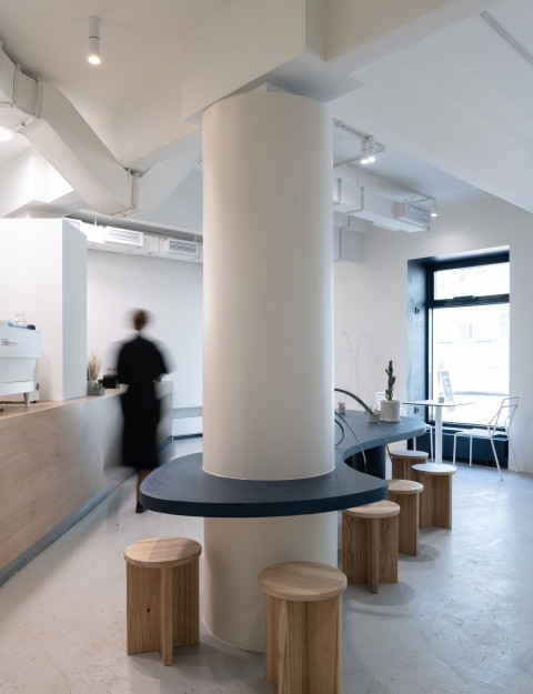 Blue wall and compact seating area in The Waterfront Cafe interior