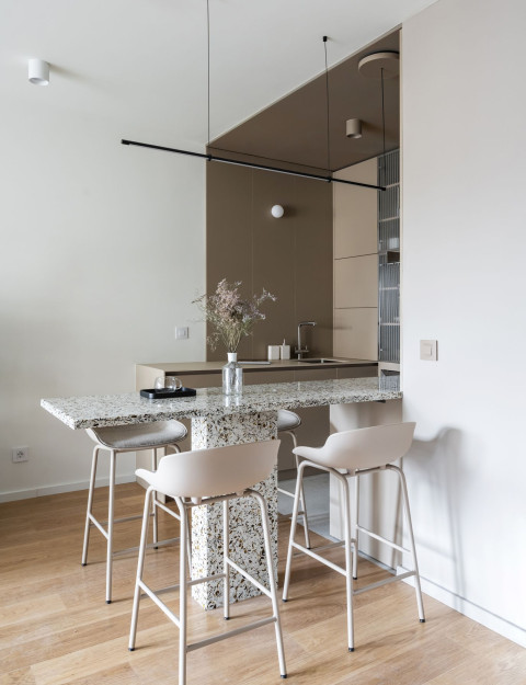 Living room material detail with papyrus white and graphite tones in Vracar Apartment