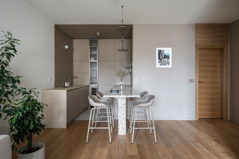 Vracar Apartment interior with graphic black window frames and calm neutral finishes