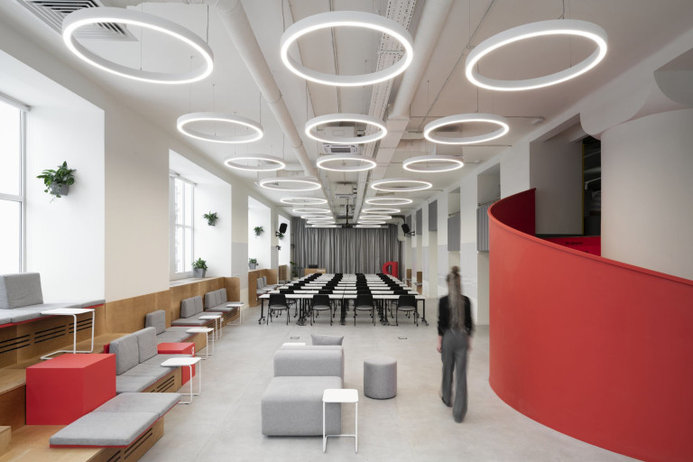 Yandex x ITMO laboratory interior with lounge seating, yellow wall and flexible student workspace