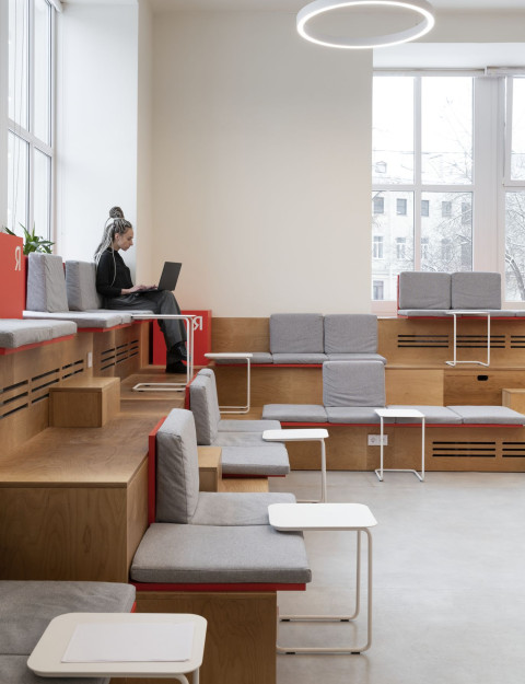 Quiet reading nook with yellow built-in seating at Yandex x ITMO laboratory