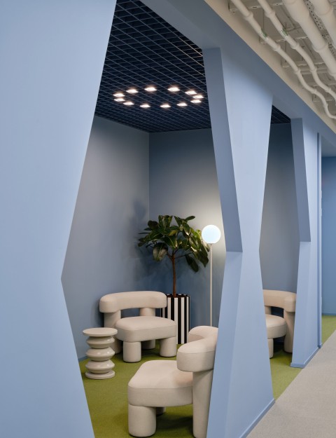 Meeting and work area with geometric color accents at Yandex Office 03