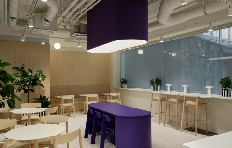 Coffee point with wood finishes and purple accent at Yandex Office 03