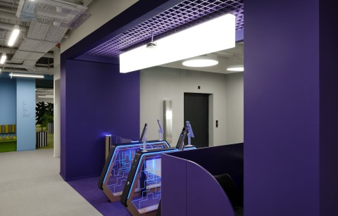 Purple entrance portal and reception area at Yandex Office 03