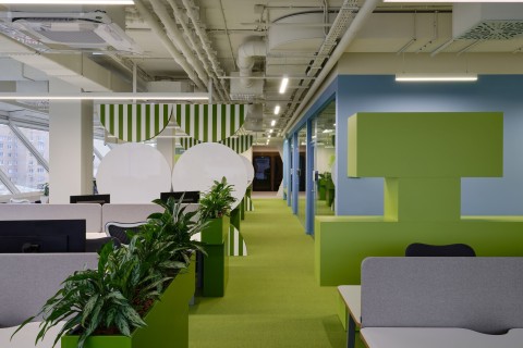 Color-coded workspace with geometric wall elements at Yandex Office 03
