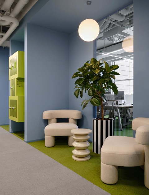 Open workspace with triangular design elements at Yandex Office 03