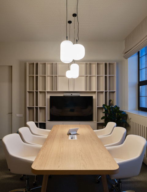 Vertical cafeteria detail at Yandex Office 02 with bar seating and integrated plants