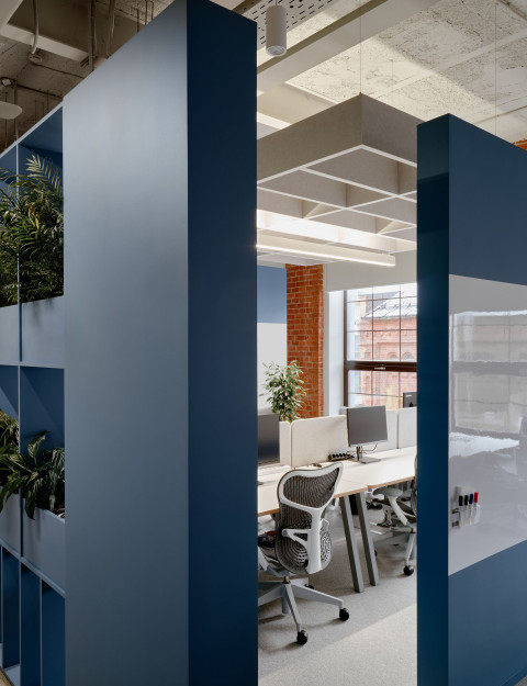 Vertical view of Yandex Office 02 showing meeting room glass and warm office materials