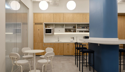 Large view of Yandex Office 02 open workspace with historical brick walls and blue partitions
