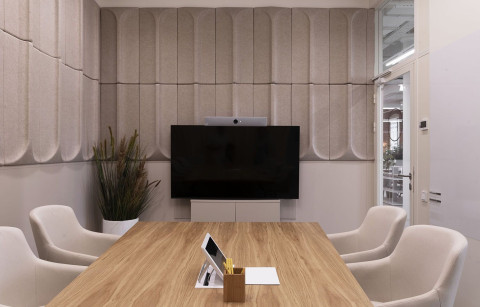 Yandex Office 01 meeting room with restored brick walls and soft neutral palette