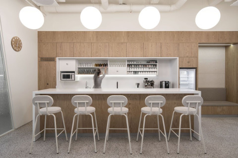 Open workspace with long desks and industrial building details in Yandex Office 01