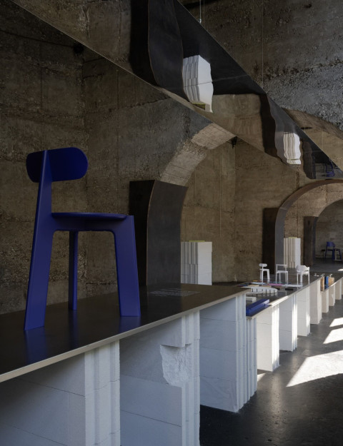 Vertical detail of exhibition furniture and creative process objects